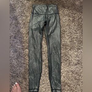 Lulu lemon leggings. Looks glossy but feels like a regular workout legging.